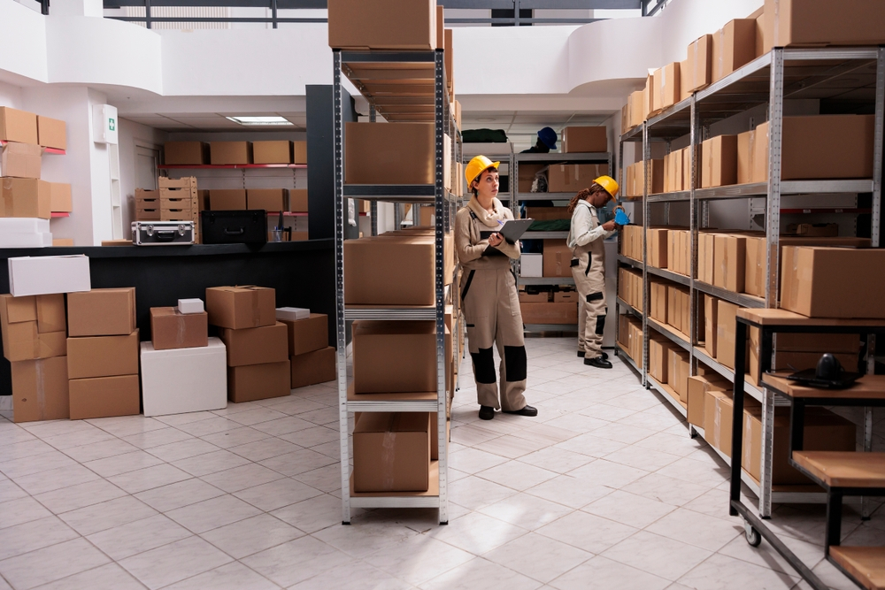 Unskilled Jobs You Can Do in the UK: A picture showing some warehouse operatives taking stock of available goods.