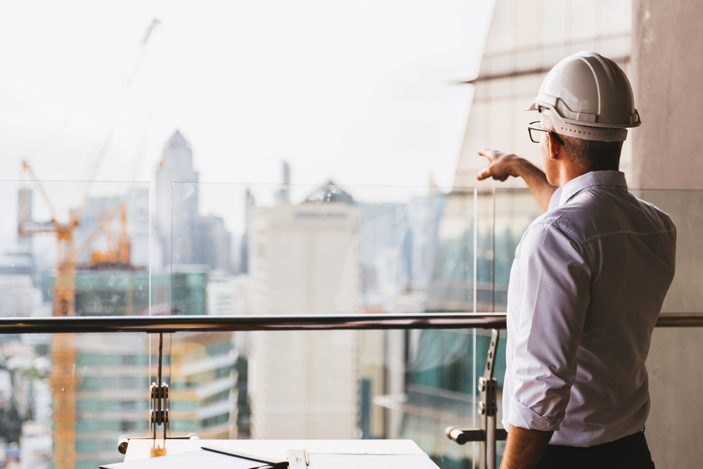Things to Know Before Applying for a UK Skilled Worker Visa: A picture showing a UK Skilled worker inspecting ongoing project.