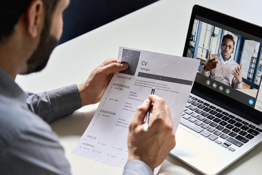 The Biggest UK Job Application Mistakes: Picture of a job seeker holding a CV application letter.
