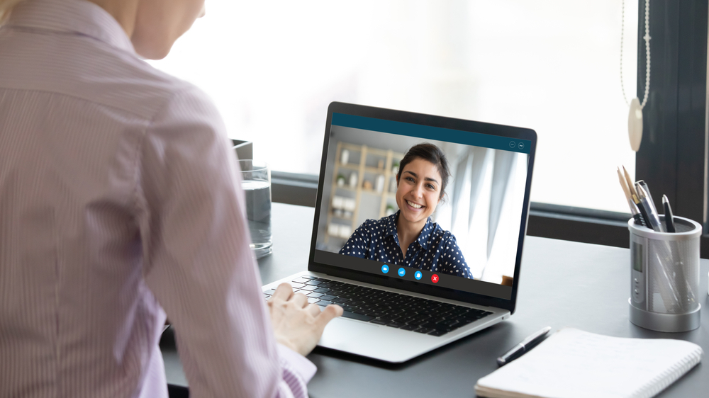 10 Secrets to Landing Your Dream Remote Job: Picture of a lady in an interview 