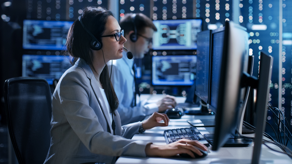 Best and Worst Industries for Remote Work: A Female working in a Technical Support Team Gives Instructions with the Help of the Headsets