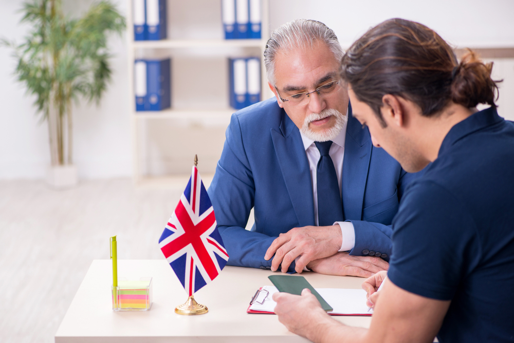 Visa Pitfalls That Can Derail Your UK Dreams: Young man visiting embassy for visa application. 