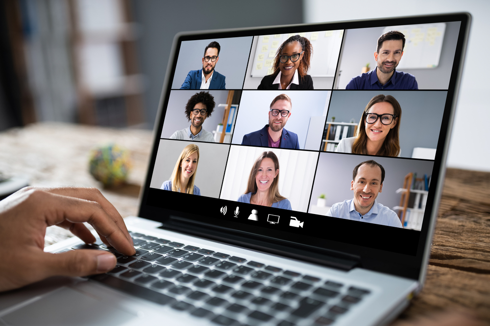 The Ultimate Guide to Landing a Remote Job with No Experience: Man Working From Home Having Online Group Video Conference On Laptop