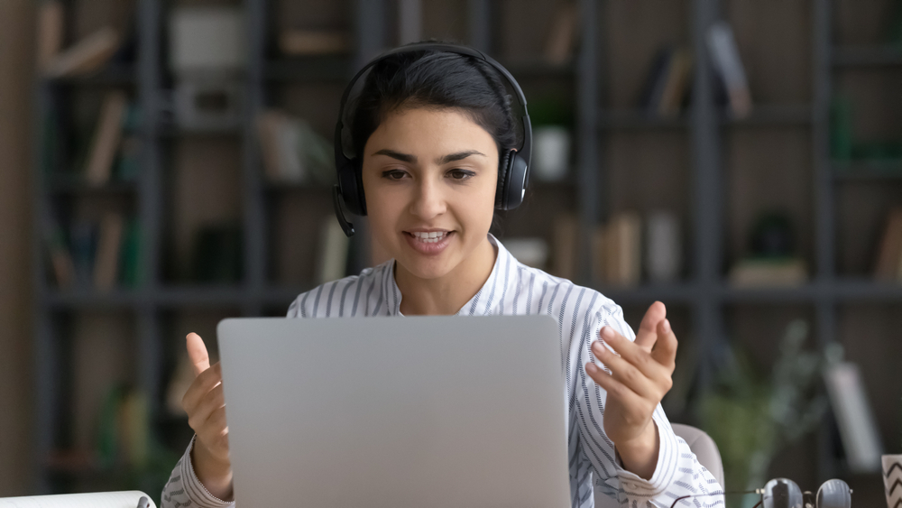 Secrets to Negotiating a Higher Salary for Your Remote Job : A female freelancer working remotely from home.