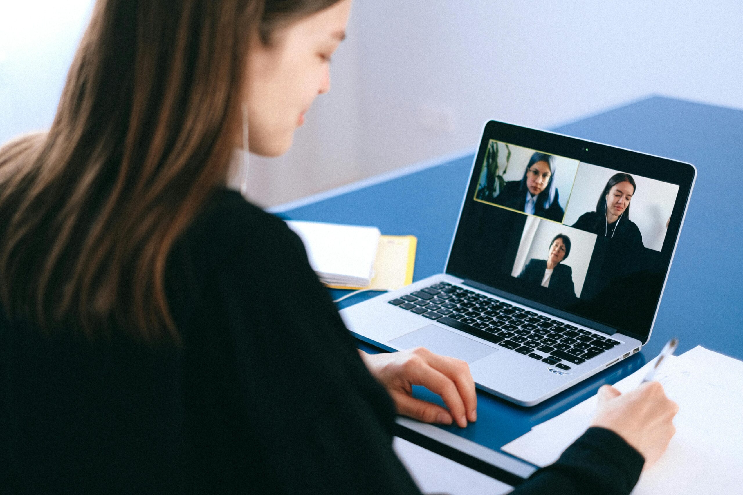The Ultimate Guide to Acing Your Remote Job Interview: Image of a lady preparing for virtual interview 
