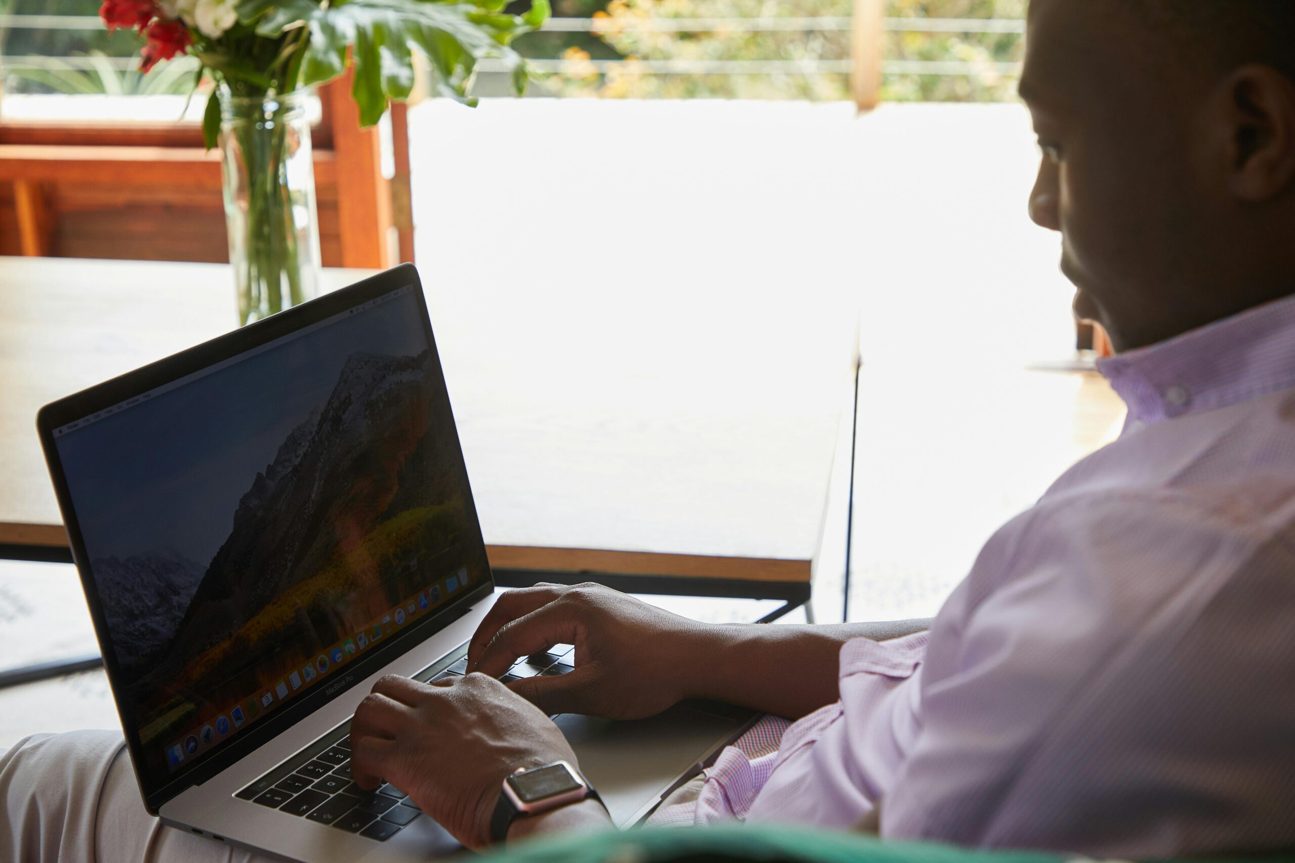 Remote Jobs in Tech vs. Remote Jobs in Healthcare: A tech guy working remotely on a laptop.