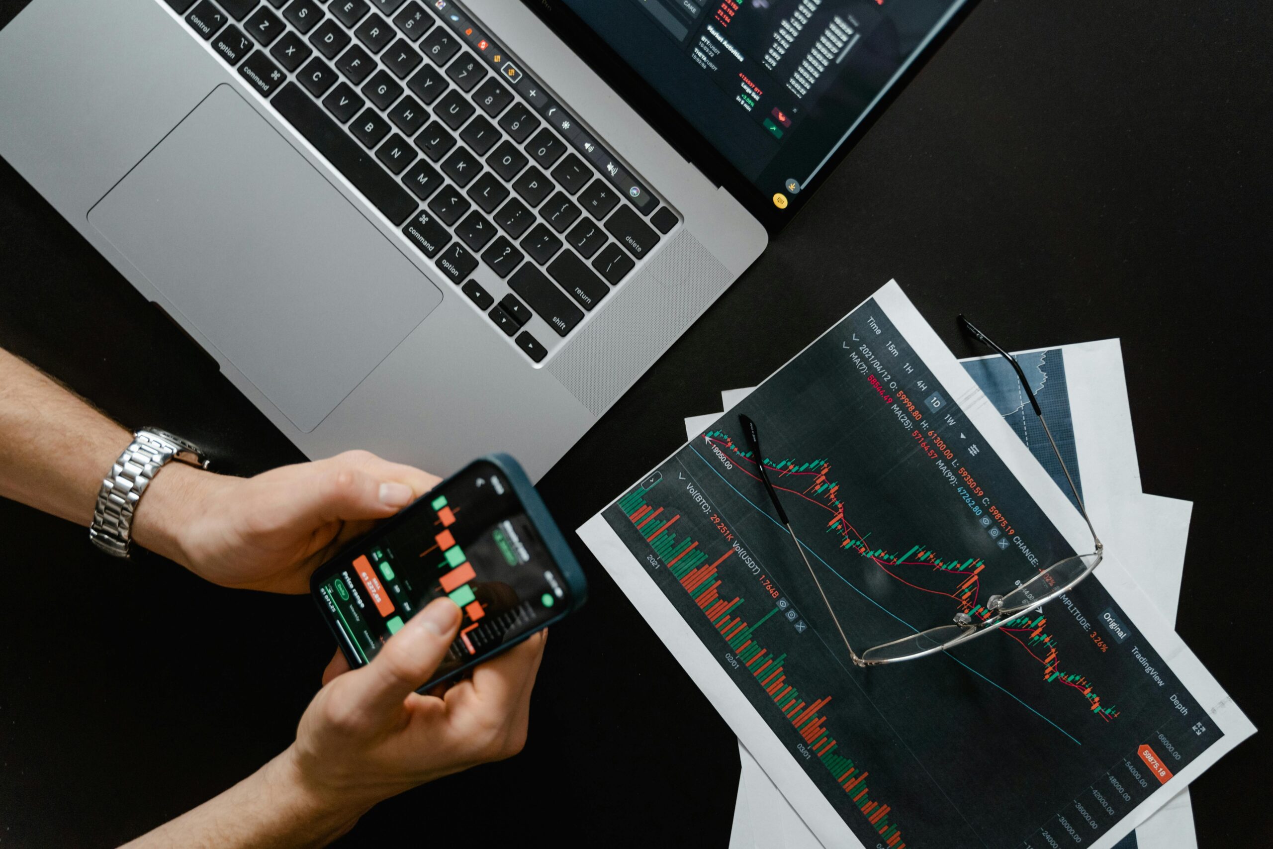 Remote Job Scams to Avoid at All Costs: Picture showing a hand trading crypto.